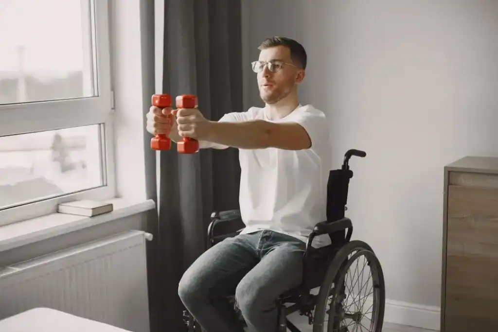 Image of man doing exercise in his wheelchair to aid weight loss Paisley