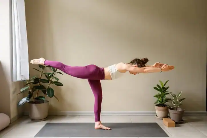 Woman doing Yoga exercise Paisley to help with toning the body. 