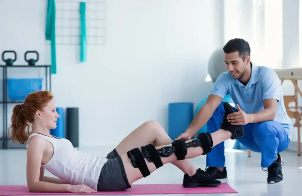 Debunking Meal Timing Myths: The Truth About Muscle Recovery 1 Woman having treatment to help muscle recovery Paisley after an injury
